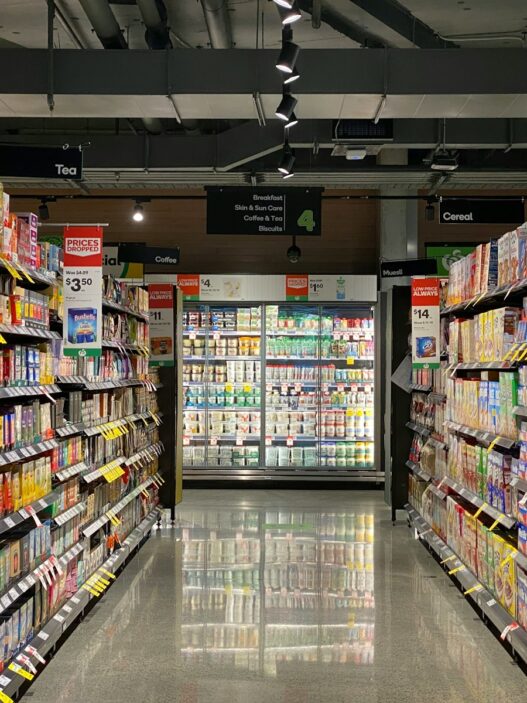 white and red labeled pack on white shelf